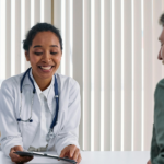 Healthcare professional reviewing a patient's chart.