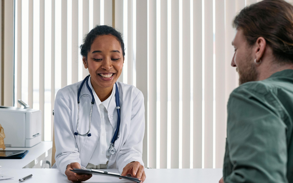 Healthcare professional reviewing a patient's chart.