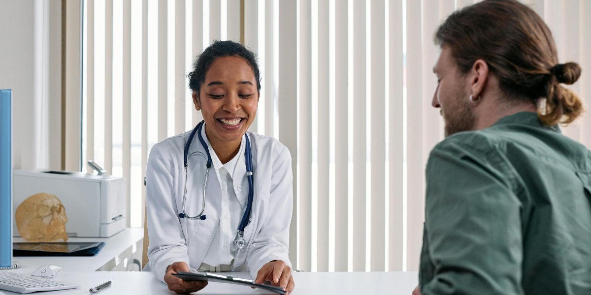 Healthcare professional reviewing a patient's chart.