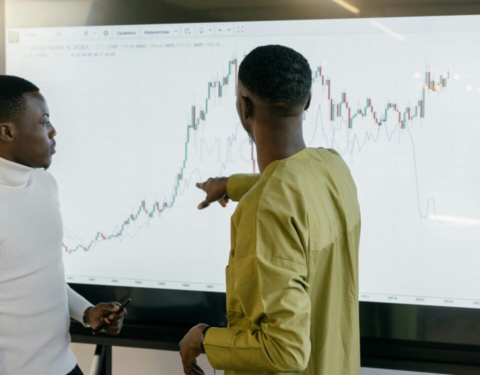 Healthcare professionals analyzing medical data charts on a digital screen in a smart hospital setting.