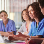 Here are alt text options for a diverse permanent healthcare staff image: Best SEO Options (includes keyphrase): 1. "Diverse permanent healthcare staff team working together to reduce agency staffing dependence