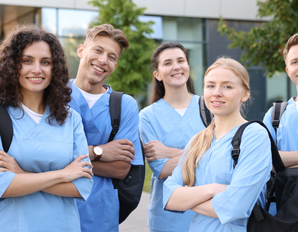 Healthcare students including sonographers, occupational therapists, and physiotherapists smiling.