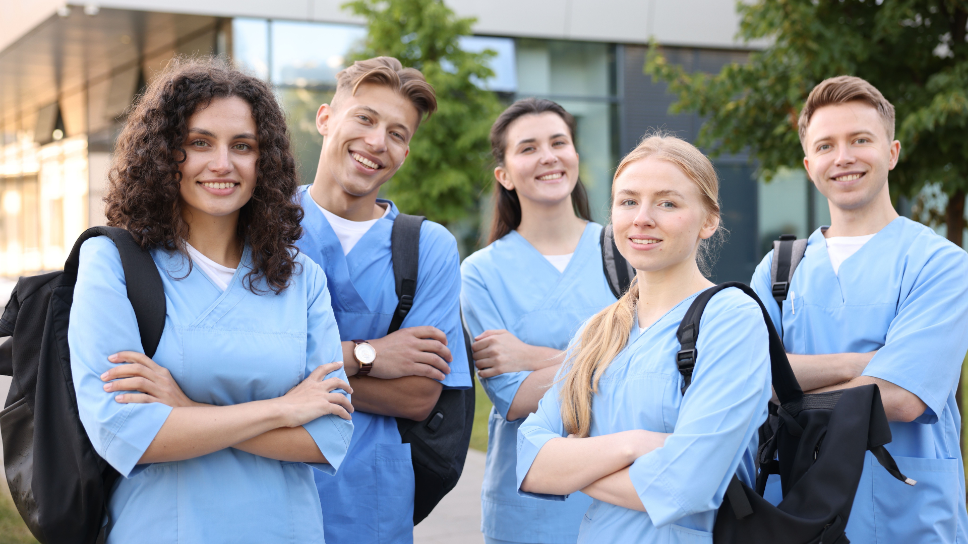 Healthcare students including sonographers, occupational therapists, and physiotherapists smiling.