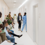 Patients waiting in hospital emergency room, representing delays caused by allied health staff shortages