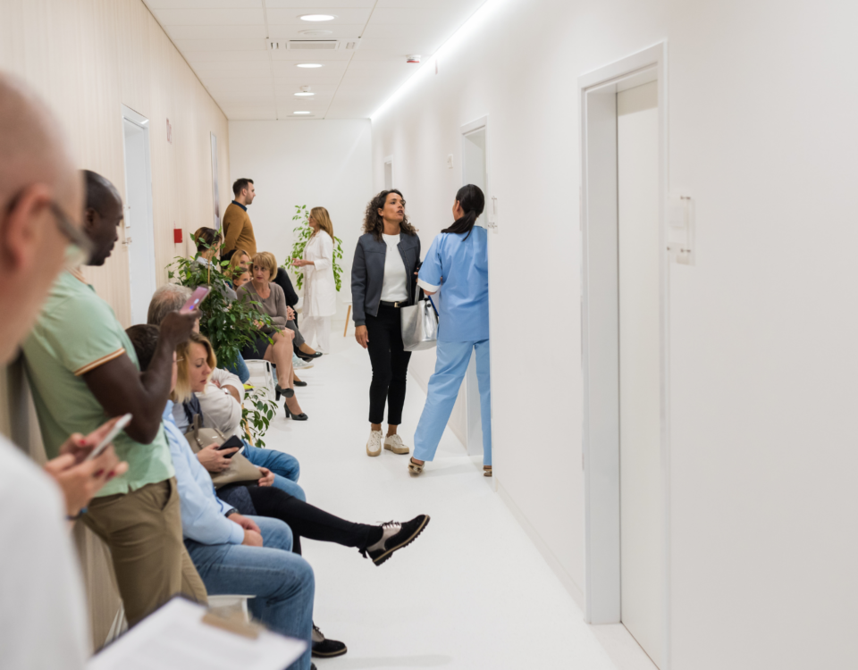 Patients waiting in hospital emergency room, representing delays caused by allied health staff shortages