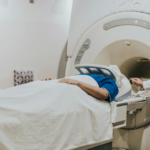 Nuclear medicine technologist (NMT) performing an MRI