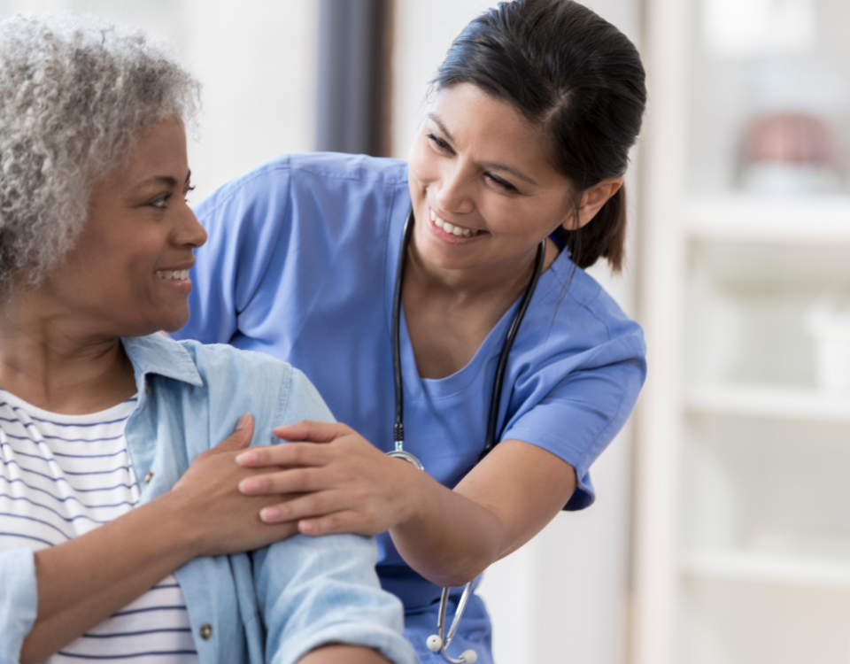Licensed Practical Nurse at her job at hospital working with an old lady